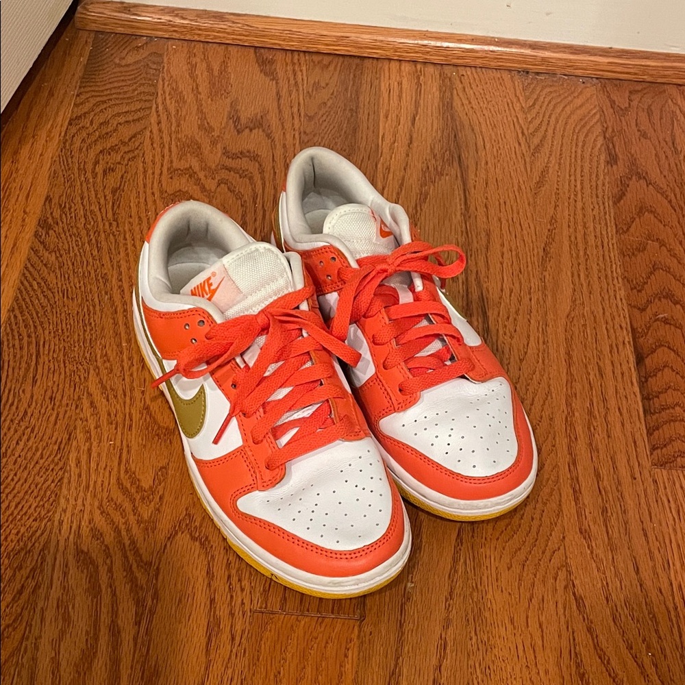 Nike Dunks Orange and White with Gold Swoosh